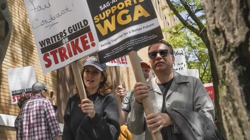 FILE - Actors and comedians Tina Fey, center, and Fred Armisen, right, join striking members of the Writers Guild of America on the picket line during a rally outside Silvercup Studios, Tuesday May 9, 2023, in New York. Unionized Hollywood actors on the verge of a strike have agreed to allow a last-minute intervention from federal mediators but say they doubt a deal will be reached by a negotiation deadline late Wednesday, July 12, 2023. (AP Photo/Bebeto Matthews, File)