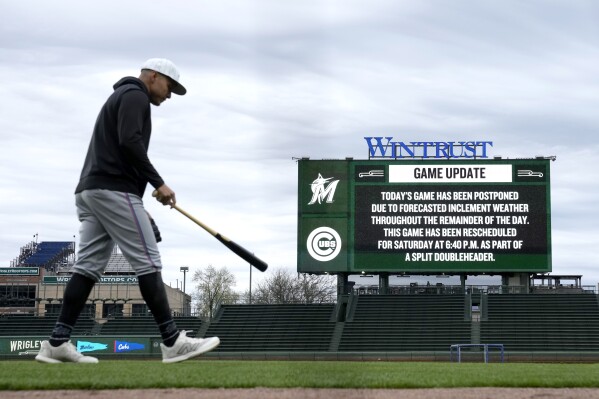Miami Marlins' Avisaíl García prepares for batting practice shortly after the team's baseball game against the Chicago Cubs was postponed Thursday, April 18, 2024, in Chicago. The teams are scheduled to play a split doubleheader Saturday. (AP Photo/Charles Rex Arbogast)