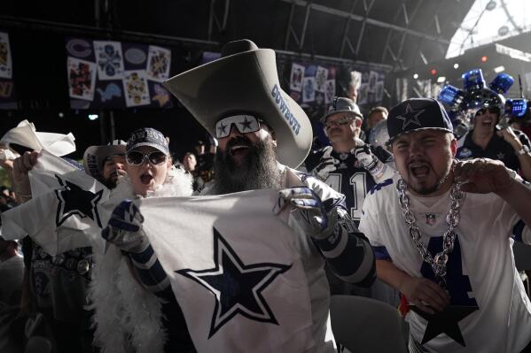 Dallas Cowboys fan cheer during the second round of the NFL football draft Friday, April 29, 2022, in Las Vegas. (AP Photo/Jae C. Hong)