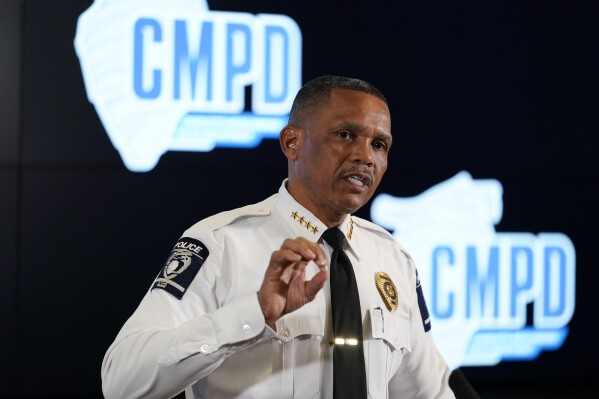 Charlotte-Mecklenburg Police Chief Johnny Jennings speaks during a news conference Wednesday, Nov. 15, 2023, in Charlotte, N.C. A video circulating on social media shows a North Carolina police officer striking a woman repeatedly during an arrest while several other officers hold her down, but police officials said the officer was “intentional” about where he hit the woman to get her to stop resisting and comply. (AP Photo/Erik Verduzco)