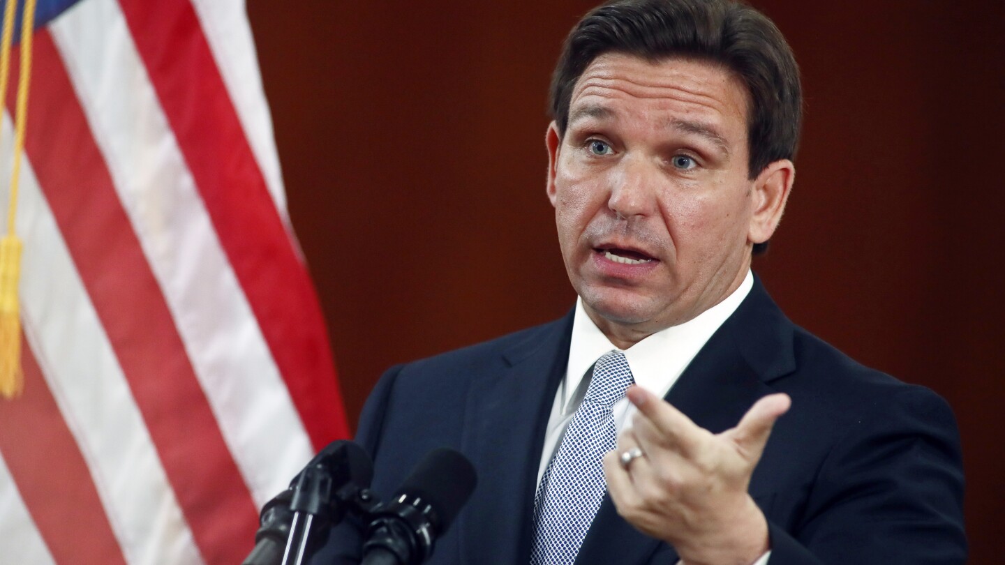 FILE - Florida Gov. Ron DeSantis answers questions from the media, March 7, 2023, at the state Capitol in Tallahassee, Fla. Florida school districts c