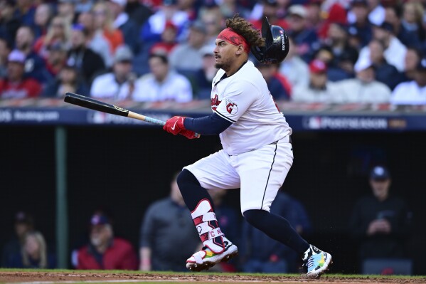 Cleveland Guardians' Josh Naylor doubles in the fifth inning during Game 2 of baseball's AL Division Series against the Detroit Tigers, Monday, Oct. 7, 2024, in Cleveland. (AP Photo/David Dermer)