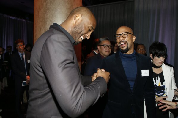 
              Kobe Bryant, and Common attend the 90th Academy Awards Nominees Luncheon at The Beverly Hilton hotel on Monday, Feb. 5, 2018, in Beverly Hills, Calif. (Photo by Danny Moloshok/Invision/AP)
            