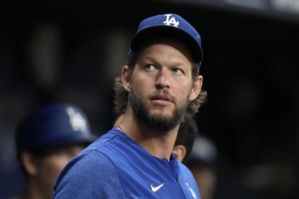 Los Angeles Dodgers starting pitcher Clayton Kershaw looks out of the dugout during the first inning of a baseball game against the Tampa Bay Rays Friday, May 26, 2023, in St. Petersburg, Fla. (AP Photo/Chris O'Meara)