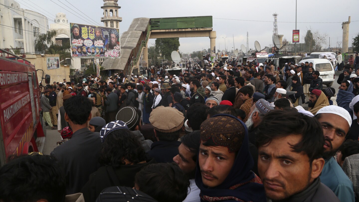 Thousands attend funeral for senior Taliban-linked cleric slain in Pakistan's northwest