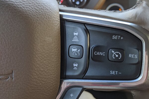 This undated photo provided by Edmunds shows a typical set of controls to set and change the following distance of adaptive cruise control. Adaptive cruise control, once only seen on luxury vehicles, has now become increasingly available on entry-level models. (Rex Tokeshi-Torres/Edmunds via AP)