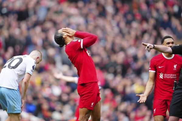 Liverpool's Virgil van Dijk reacts during the English Premier League soccer match between Liverpool and Crystal Palace at Anfield Stadium in Liverpool, England, Sunday, April 14, 2024. (AP Photo/Jon Super)