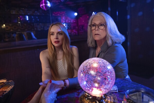 This image released by Disney shows Lindsay Lohan, left, and Jamie Lee Curtis in a scene from "Freakier Friday." (Glen Wilson/Disney via AP)