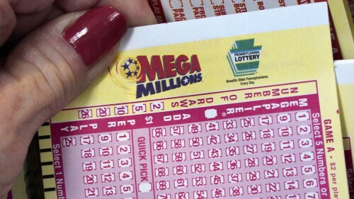 FILE - A Mega Millions wagering slip is held in Cranberry Township, Pa., Jan. 12, 2023. The Mega Millions jackpot has grown again, to at least an estimated $640 million, after there was no winner Friday night, July 14. (AP Photo/Gene J. Puskar, File)