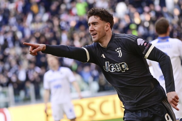 Juventus' Dusan Vlahovic celebrates after scoring their side's first goal of the game during the Serie A soccer match between Juventus and Frosinone at the Allianz Stadium in Turin, north west Italy, Sunday, Feb. 25, 2024. (Marco Alpozzi/LaPresse via AP)