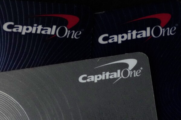 Capital One credit cards are shown in Mount Prospect, Ill., Tuesday, Feb. 20, 2024. Capital One Financial is buying Discover Financial Services for $35 billion, in a deal that would bring together two of the nation’s biggest lenders and credit card issuers. (AP Photo/Nam Y. Huh)