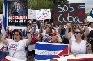 Demonstrators shout their solidarity with the Cuban people against the communist government during a rally outside the White House in Washington, Saturday, July 17, 2021.(AP Photo/Jose Luis Magana)