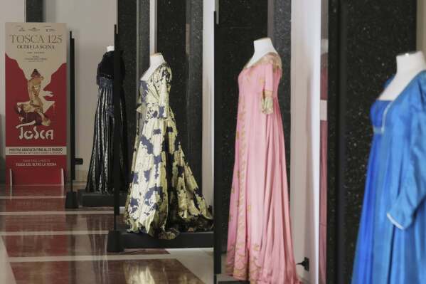 Historical costumes from Giacomo Puccini's "Tosca" opera are on display inside the foyer of the "Teatro dell' Opera" opera house, in Rome, Thursday, April 10, 2025. (AP Photo/Andrew Medichini)