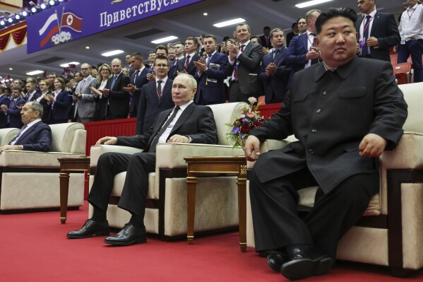 Russian President Vladimir Putin, center, North Korean leader Kim Jong Un, right, and Russian Foreign Minister Sergei Lavrov, left, attend a gala concert in Pyongyang, North Korea, on Wednesday June 19, 2024. (Gavriil Grigorov, Sputnik, Kremlin Pool photo via AP)