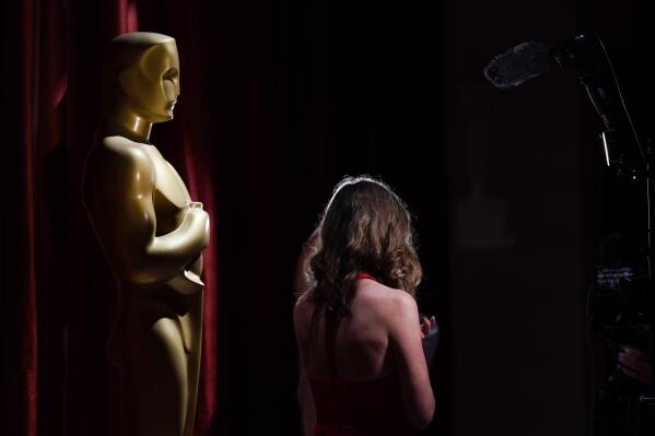A person speaks on camera during preparations for Sunday's 95th Academy Awards, Saturday, March 11, 2023, in Los Angeles. (AP Photo/Ashley Landis)