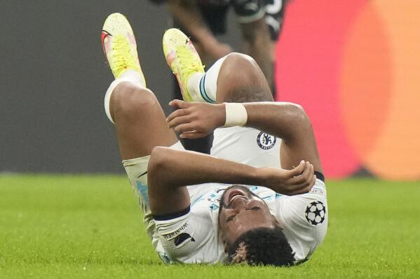 Chelsea's Reece James grimaces in pain after after a challenge during a Group E soccer match between AC Milan and Chelsea FC, at the San Siro stadium in Milan, Italy, Tuesday, Oct. 11, 2022. (AP Photo/Luca Bruno)