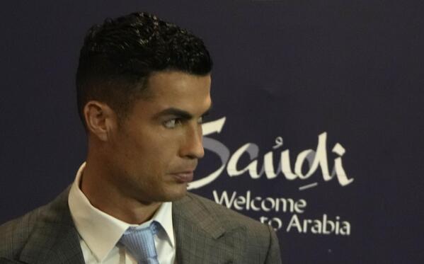 Cristiano Ronaldo looks EXCITED to be modelling as he strips to