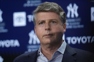 FILE - New York Yankees' owner Hal Steinbrenner attends a news conference at Yankee Stadium, Wednesday, Dec. 21, 2022, in New York. Hal Steinbrenner questioned current and former players along with staff on whether to keep Aaron Boone before deciding the New York manager will return next year. “We had a winning season. ... That's not an accomplishment, that's a requirement,” Steinbrenner said Tuesday, Nov. 7, 2023, during an online news conference. (AP Photo/Seth Wenig, File)