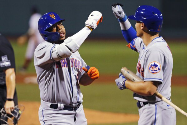 New York Mets' Dominic Smith (22) celebrates his solo home run