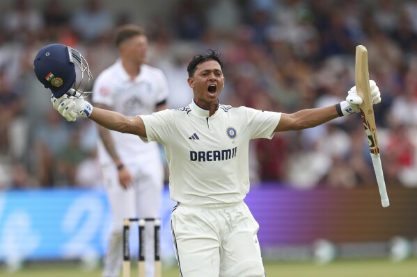 India's Yashasvi Jaiswal celebrates after scoring a century during the play on day one of the first cricket test match between England and India at Headingley in Leeds, England, Friday, June 20, 2025, (AP Photo/Scott Heppell)