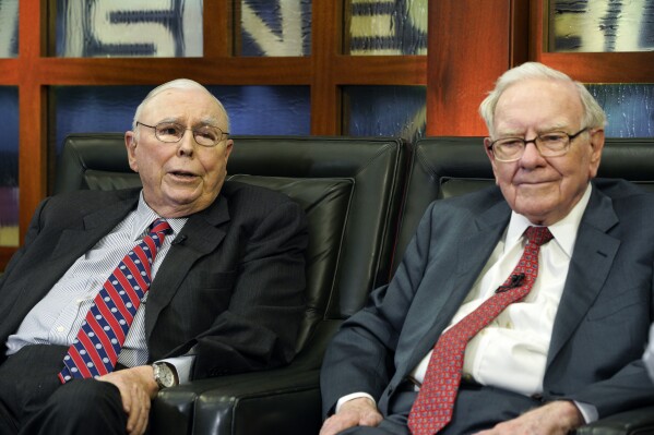 FILE - Berkshire Hathaway Chairman and CEO Warren Buffett, right, and his Vice Chairman Charlie Munger, left, speak during an interview in Omaha, Neb., Monday, May 7, 2018, with Liz Claman on Fox Business Network's "Countdown to the Closing Bell". Munger, who helped Warren Buffett build Berkshire Hathaway into an investment powerhouse, died Tuesday, Nov. 28, 2023, at a California hospital the company announced.. He was 99. (AP Photo/Nati Harnik, File)