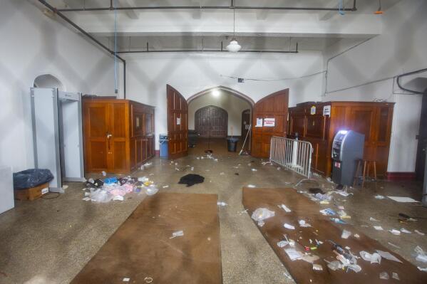 Debris is seen in the main entrance of Main Street Armory on Monday, March 6, 2023, in Rochester, N.Y following a stampede that left one dead and several injured. (AP Photo/Lauren Petracca)