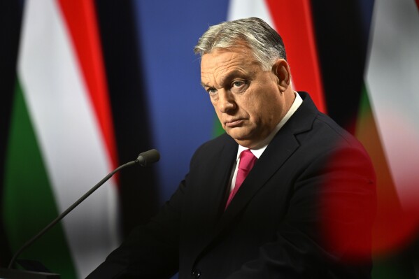 Hungarian Prime Minister Viktor Orban arrives for an annual international press conference in Budapest, Hungary, Thursday, Dec. 21, 2023. (AP Photo/Denes Erdos)