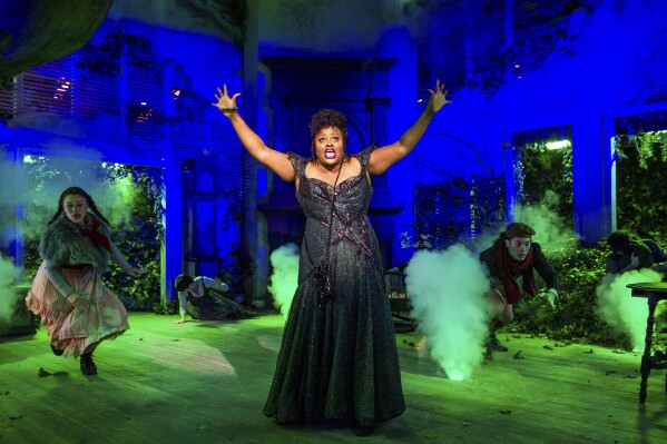 This image released by the Signature Theatre shows Nova Y. Payton during a performance of "Into the Woods" at the Signature Theatre in Arlington, Va. The theater offers a monthly streaming interview program, new online play readings and digital previews of upcoming shows for subscribers. (Daniel Rader/Signature Theatre via AP)