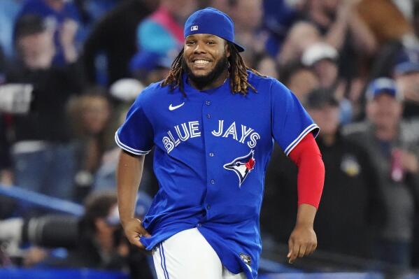 FILE - Toronto Blue Jays' Vladimir Guerrero Jr. celebrates after the team's win over the Tampa Bay Rays in a baseball game Sept. 14, 2022, in Toronto. Guerrero and the Blue Jays avoided salary arbitration Friday night, Jan. 13, by agreeing to a $14.5 million contract for next season. (Frank Gunn/The Canadian Press via AP, File)