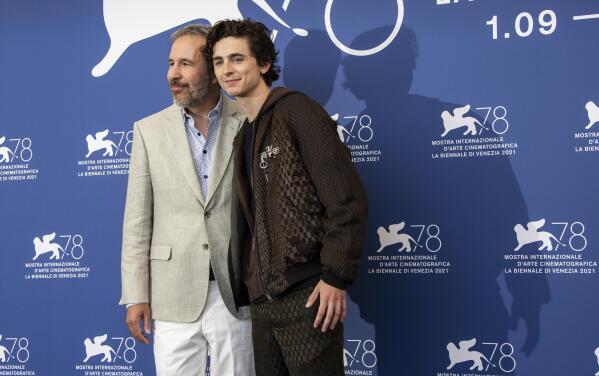 Denis Villeneuve, left, and Timothee Chalamet pose for photographers at the photo call for the film 'Dune' during the 78th edition of the Venice Film Festival in Venice, Italy, Friday, Sep, 3, 2021. (Photo by Joel C Ryan/Invision/AP)