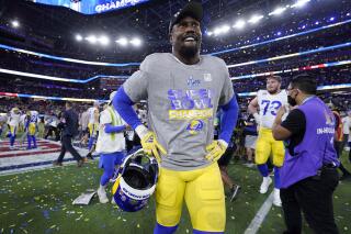 FILE - Los Angeles Rams outside linebacker Von Miller (40) celebrates their victory against the Cincinnati Bengals in Super Bowl 56 on Feb. 13, 2022, in Inglewood, Calif. (AP Photo/Steve Luciano, File)