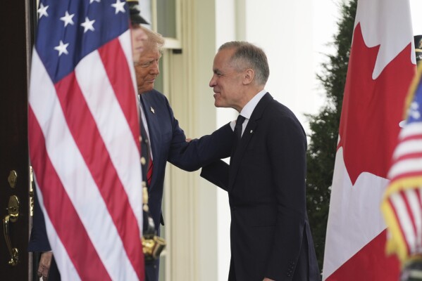 President Donald Trump greets Canadian Prime Minister Mark Carney at the White House, Tuesday, May 6, 2025, in Washington. (AP Photo/Evan Vucci)