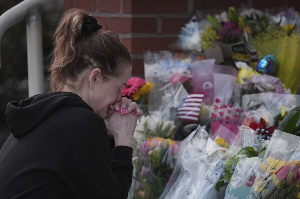 Linda Shields pays her respects in front of the West York Police Department after a police officer was killed responding to a shooting at UPMC Memorial Hospital in York, Pa., Feb. 22, 2025. (AP Photo/Matt Rourke, File)