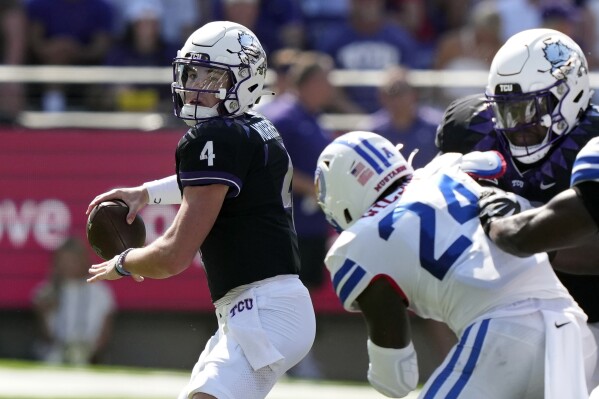 TCU quarterback Chandler Morris (4) looks to pass as SMU linebacker Kobe Wilson (24) is blocked during the first half of an NCAA college football game Saturday, Sept. 23, 2023, in Fort Worth, Texas. (AP Photo/LM Otero)