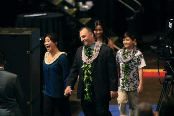 Josh Green arrives with his wife, Jaime, daughter Maia and son Sam to his inauguration as Hawaii's new governor on Monday, Dec. 5, 2022, in Honolulu. Green has spent the past four years as lieutenant governor under fellow Democrat David Ige, who served two terms and was not eligible to run again. (Jamm Aquino/Honolulu Star-Advertiser via AP)