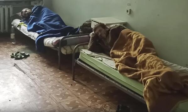 In this photo taken from video released by the Russian Defense Ministry on Wednesday, May 18, 2022, shows wounded Ukrainian servicemen lying in a hospital in Novoazovsk, Ukraine, in territory under the government of the Donetsk People's Republic, after they were evacuated from Azovstal steel plant in Mariupol. (Russian Defense Ministry Press Service via AP)