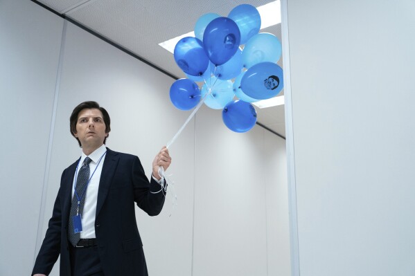 This image released by Apple TV+ shows Adam Scott in a scene from "Severance." (Jon Pack/Apple TV+ via AP)