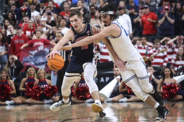 Arizona forward Azuolas Tubelis (10) is defended by UCLA guard Jaime Jaquez Jr. during the second half of an NCAA college basketball game for the championship of the men's Pac-12 Tournament, Saturday, March 11, 2023, in Las Vegas. (AP Photo/Chase Stevens)