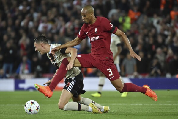 FILE - Liverpool's Fabinho, right, is challenged by Ajax's Steven Berghuis during the Champions League group A soccer match between Liverpool and Ajax at Anfield stadium in Liverpool, England, Sept. 13, 2022. Liverpool lost another midfielder to the emerging Saudi Pro League on Monday July 31, 2023, when Brazil midfielder Fabinho joined Al-Ittihad, the team where Karim Benzema and N'Golo Kanté now play. (AP Photo/Rui Vieira, File)