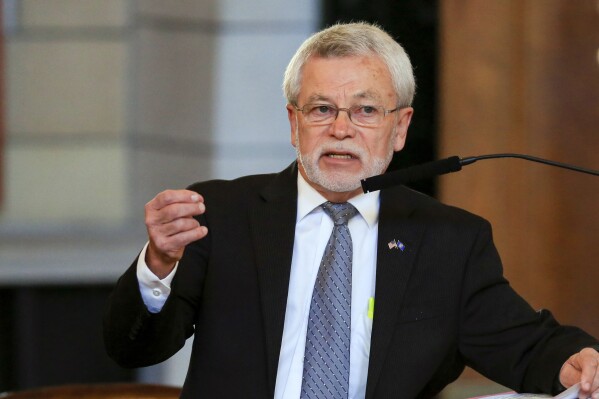 FILE - Neb. State Sen. Steve Halloran of Hastings speaks during debate, Monday, Jan. 8, 2018, in the Legislative Chamber in Lincoln, Neb. Halloran is facing calls to resign after reading a graphic account of rape from a best-selling memoir on the floor of the Legislature on Monday, March 18, 2024, in which he repeatedly invoked the name of a fellow lawmaker, making it appear as if that lawmaker was the subject of the assault.(AP Photo/Nati Harnik, File)