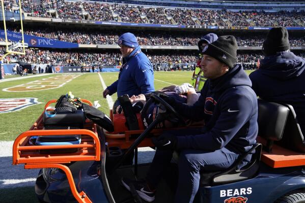 Chicago Bears' Teven Jenkins is carted off the field after an injury during the first half of an NFL football game against the Philadelphia Eagles, Sunday, Dec. 18, 2022, in Chicago. (AP Photo/Nam Y. Huh)