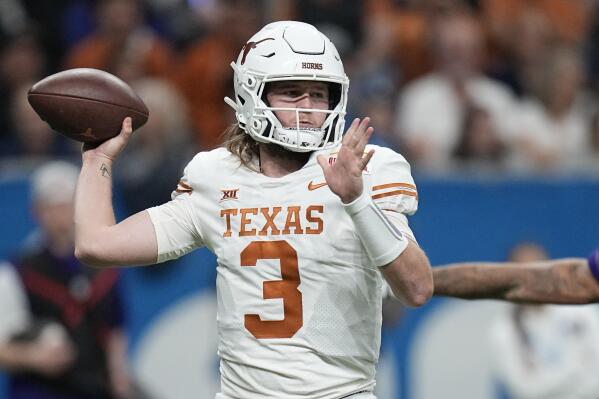 FILE - Texas quarterback Quinn Ewers (3) looks to pass against Washington during the second half of the Alamo Bowl NCAA college football game in San Antonio, Thursday, Dec. 29, 2022. Texas wraps spring practice Saturday with the Longhorns' annual scrimmage, allowing the first real look at the biggest quarterback battle in the Big 12 between Ewers, early-enrolled freshman Arch Manning of the famed football family, and second-year reserve Maalik Murphy, a top recruit who spent his freshman season of 2022 on the sidelines. (AP Photo/Eric Gay, File)