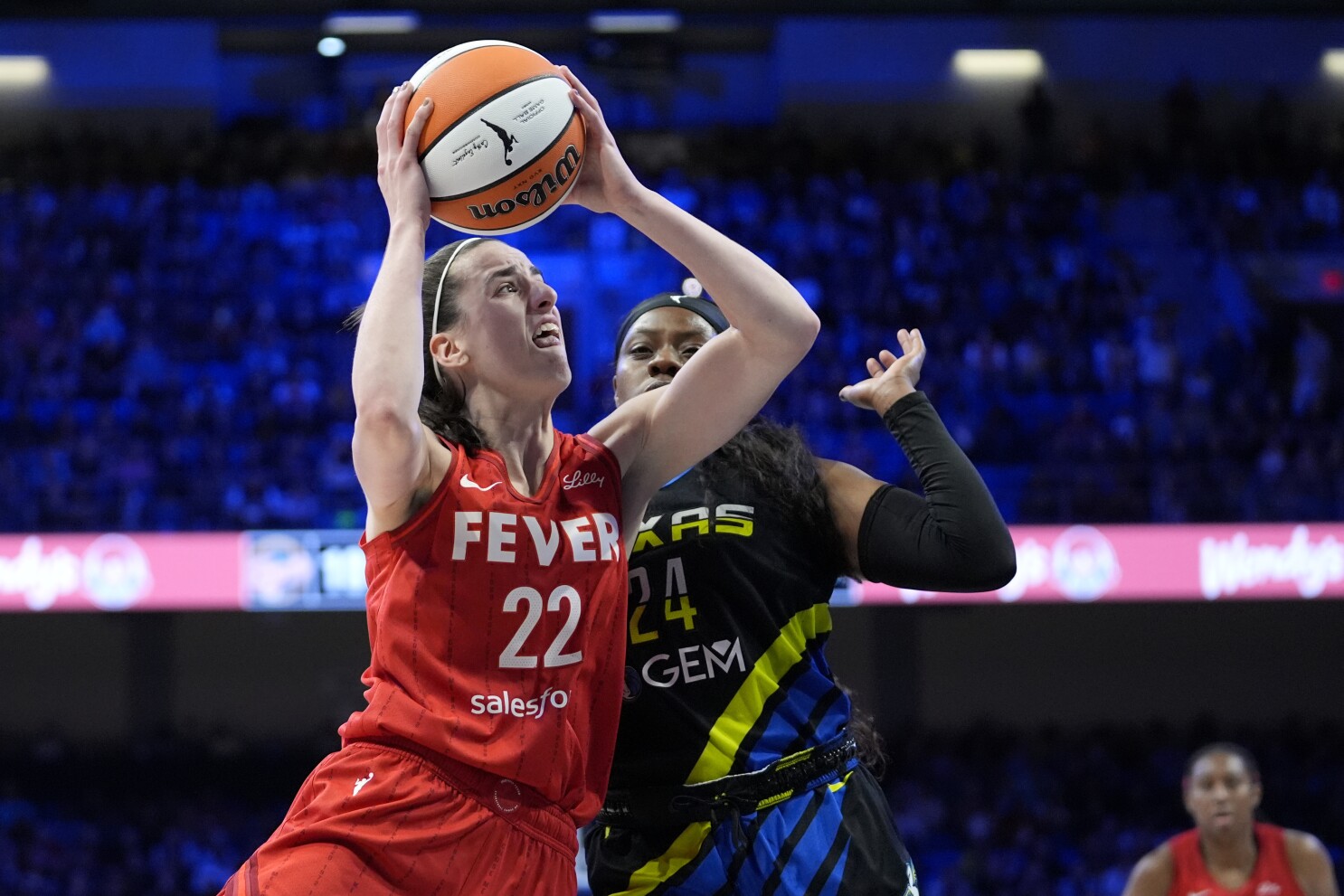 Caitlin Clark scores 28, Fever overcome Arike Ogunbowale's record-tying 9 3s and beat Wings 100-93