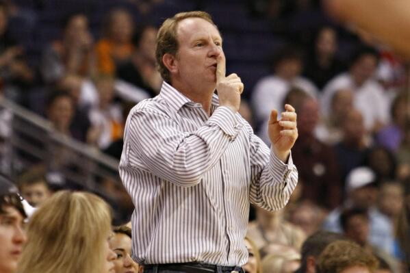 FILE - Phoenix Suns owner Robert Sarver gestures to Indiana Pacers' Danny Granger after Granger missed a shot during the second half of an NBA basketball game Saturday, March 6, 2010 in Phoenix. Robert Sarver says he has started the process of selling the Phoenix Suns and Phoenix Mercury, a move that comes only eight days after he was suspended by the NBA over workplace misconduct including racist speech and hostile behavior toward employees. Sarver made the announcement Wednesday, Sept. 21, 2022, saying selling “is the best course of action.” He has owned the teams since 2004. (AP Photo/Matt York, File)