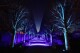 Visitors to the Chicago Botanic Garden's Lightscape holiday experience of light and music, pass through the constantly changing light of "Love and Be Loved," created by Chicago artists Lee Fiskness and Travis Shupe, in Glencoe, Ill., on Thursday, Dec. 14, 2023. (AP Photo/Charles Rex Arbogast)