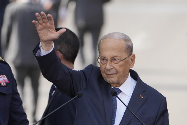 Lebanese President Michel Aoun waves for his supporters during a speech to his supporters gathered outside the presidential palace in Baabda, east of Beirut, Lebanon, Sunday, Oct. 30, 2022.  Aoun left Lebanon's presidential palace Sunday marking the end of his six-year term without a replacement, leaving the small nation in a political vacuum that is likely to worsen its historic economic meltdown. (AP Photo/Bilal Hussein)