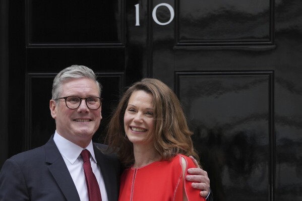 FILE - Britain's Labour Party Prime Minister Keir Starmer and his wife Victoria pose for the media on the doorstep of 10 Downing Street in London, Friday, July 5, 2024.After a few hours of sleep to shake off a night of celebration and an audience with the king, Keir Starmer will step through the front door of 10 Downing St. for the first time as prime minister on Friday. (AP Photo/Kin Cheung, File)