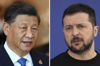FILE - This combination of file photos shows China's President Xi Jinping, left, taken in Bangkok, on Nov. 19, 2022, and Ukrainian President Volodymyr Zelenskyy taken outside Kyiv, on April 7, 2023. A Chinese envoy was preparing Monday, May 15, 2023 to visit Ukraine and Russia, but there appeared to be little chance of a breakthrough to end the 15-month-long invasion. (AP Photo, File)