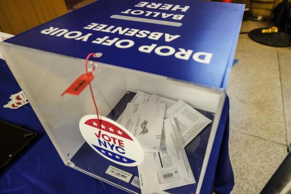 FILE - Absentee ballots are seen in a sealed ballot box during early voting in the primary election, Monday, June 14, 2021, at the Church of St. Anthony of Padua in New York. New York would extend absentee balloting through the rest of 2022 under a bill that breezed through the Democratic-controlled Senate and Assembly this month. (AP Photo/Mary Altaffer, File)