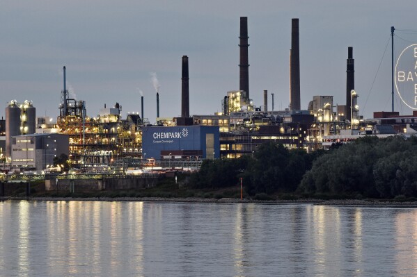 FILE - The main chemical plant of German Bayer AG is pictured on Thursday, Aug. 9, 2019 in Leverkusen, Germany. A low-rise city of 167,000 that grew up around the factories of the pharmaceuticals giant Bayer, Leverkusen has little to draw tourists besides its internationally famed soccer club. The team finished an entire German Bundesliga season unbeaten Saturday and is now targeting trophies in the Europa League and German Cup. (AP Photo/Martin Meissner, File)